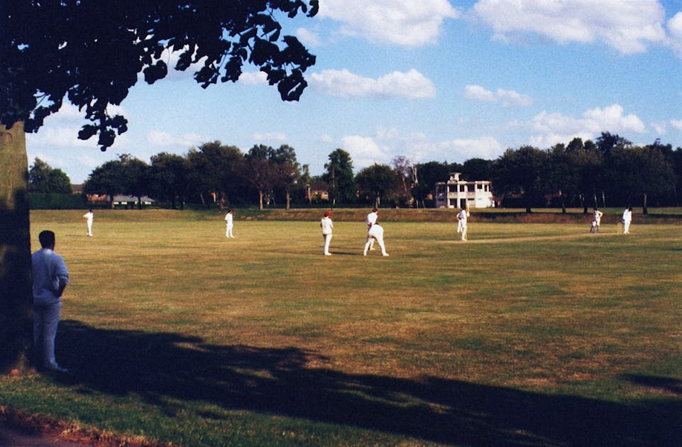 A cricket scorecard on the field